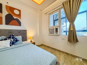 Ліжко або ліжка в номері Raghuveer Sadan, Near Ram Mandir -10 Min Walk