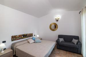 Ένα ή περισσότερα κρεβάτια σε δωμάτιο στο Villetta Carlotta in residence +3 φωτογραφίες