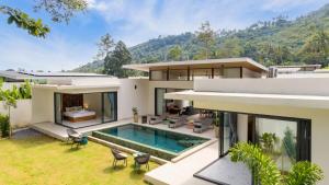 an image of a house with a swimming pool at Villa Gabriela Garden view - Included Airport pick up in Nathon Bay