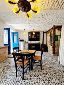 a dining room with a table and chairs and a kitchen at Káli Cool in Káptalantóti +37 photos