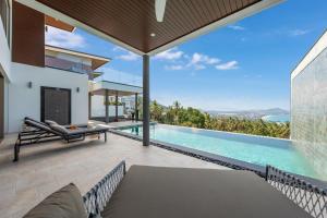 an image of a villa with a swimming pool at Chaweng Noi villa Managed by Saitara peak in Amphoe Koh Samui