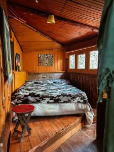 Postel nebo postele na pokoji v ubytování Refugio Aldea Infinita