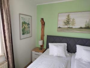 Posteľ alebo postele v izbe v ubytovaní Wohnung mit Charme in Pinsdorf