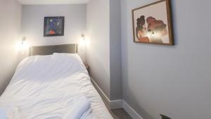 Ένα ή περισσότερα κρεβάτια σε δωμάτιο στο Stylish 1-Bedroom Apartment in Slough with Parking