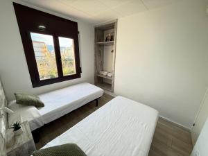 Posteľ alebo postele v izbe v ubytovaní Agi Montseny