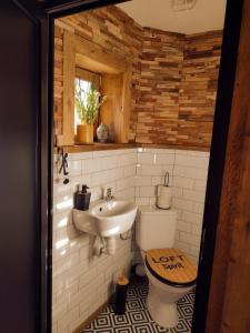 a bathroom with a toilet and a sink at Holiday apartement Sentjur in Šentjur +9 photos