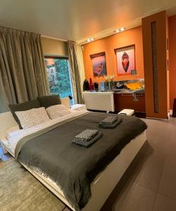 a bedroom with a large bed with two keyboards on it at Dom nad Jeziorem Gwiazda in Wójcin