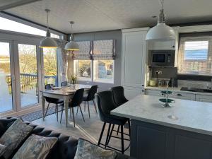 a kitchen and living room with a table and chairs at Pablos Place in York