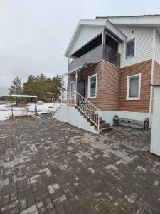 a house with a stone driveway in front of it at дом в Боровом Сарыбулак 4 комнатный in Vorobʼyëvka