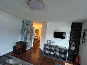 TV in/ali zabaviščno središče v nastanitvi Apartment Leitn