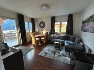 Predel za sedenje v nastanitvi Apartment Leitn