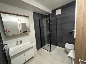 Kopalnica v nastanitvi Apartment Leitn