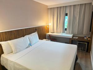 Cama ou camas em um quarto em Hotel WZ Jardins