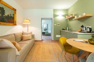 a living room with a couch and a table at Origine Country Farm in Tabiano