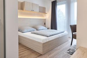 Postel nebo postele na pokoji v ubytování Bader Aparthotel