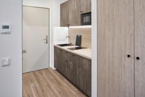 O bucătărie sau chicinetă la Bader Aparthotel
