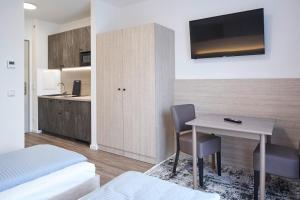 Kuchyň nebo kuchyňský kout v ubytování Bader Aparthotel