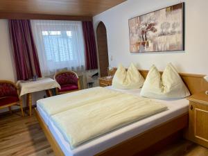 Postel nebo postele na pokoji v ubytování Haus Gröblacher