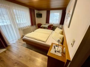 Postel nebo postele na pokoji v ubytování Haus Gröblacher