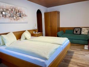 Postel nebo postele na pokoji v ubytování Haus Gröblacher