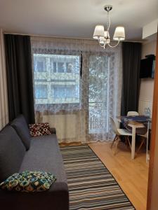 a living room with a couch and a table at Willa na Wilcznik in Zakopane