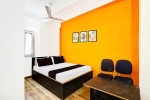 Postel nebo postele na pokoji v ubytování Hotel O YAS DEV