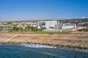 an aerial view of a city and the ocean at Atlantica Sungarden Park in Ayia Napa