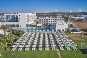 an aerial view of a resort with a pool and umbrellas at Atlantica Sungarden Park in Ayia Napa