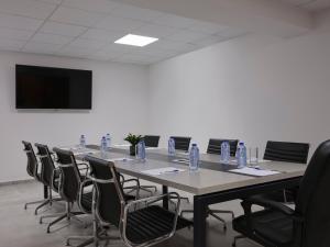 a conference room with a long table and chairs at Atlantica Sungarden Park in Ayia Napa +37 photos