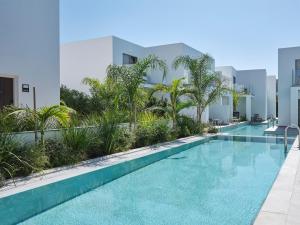 a swimming pool in the middle of a building at Atlantica Sungarden Park in Ayia Napa
