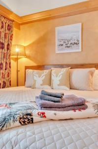 a bedroom with a bed with pillows on it at Cozy Studio Wood Fireplace in Ellicottville
