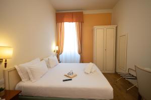 Postel nebo postele na pokoji v ubytování Hotel Pallanza by LVG Hotel Collection + 37 fotografií