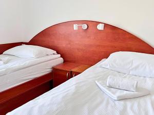 Posteľ alebo postele v izbe v ubytovaní Hotel Sjesta