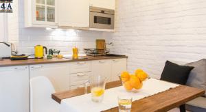 Kuchyň nebo kuchyňský kout v ubytování Kurkowa GamaHome Cozy Apartments