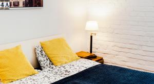 Postel nebo postele na pokoji v ubytování Kurkowa GamaHome Cozy Apartments
