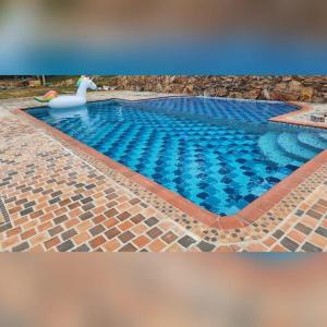 a swimming pool with a swan in the middle at Casa Campestre la Martina in La Honda