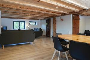 a dining room with a table and chairs at Le Perchoir du Grand Valtin - Gîte 5 personnes - Altitude 830 in Ban-sur-Meurthe-Clefcy