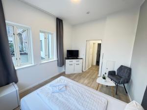 Postel nebo postele na pokoji v ubytování Nikolai Appartements
