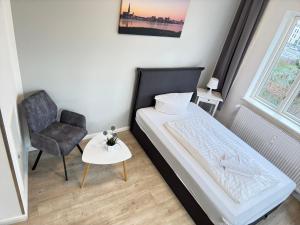 Postel nebo postele na pokoji v ubytování Nikolai Appartements