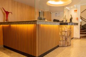 O saguão ou recepção de Fenix Hotel Pouso Alegre