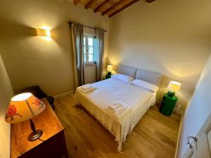 Postel nebo postele na pokoji v ubytování Borgo dei Rosai