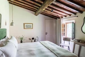 Voodi või voodid majutusasutuse Pieve Aldina Relais & Châteaux toas