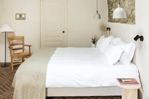 Voodi või voodid majutusasutuse Pieve Aldina Relais & Châteaux toas