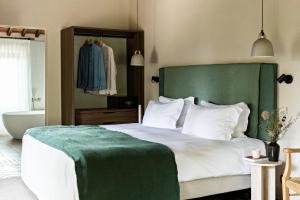 Voodi või voodid majutusasutuse Pieve Aldina Relais & Châteaux toas