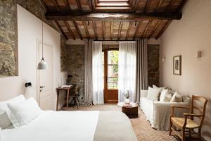 Voodi või voodid majutusasutuse Pieve Aldina Relais & Châteaux toas