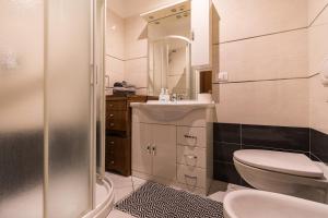 Koupelna v ubytování Appartamento Confortevole con posto auto gratuito e wifi + 9 fotografií