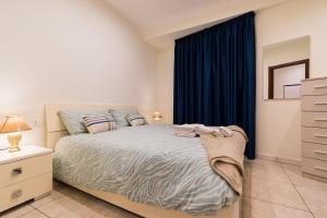 Postel nebo postele na pokoji v ubytování Appartamento Confortevole con posto auto gratuito e wifi