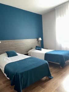 Postel nebo postele na pokoji v ubytování Hotel Caiman + 35 fotografií