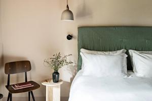 Voodi või voodid majutusasutuse Pieve Aldina Relais & Châteaux toas