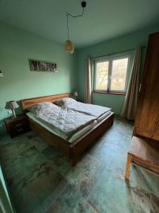 Postel nebo postele na pokoji v ubytování Ferienwohnung 2 Km an der A9 nähe Potsdam Berlin